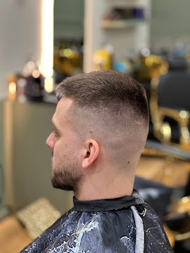 Short textured cut with a skin fade finished at Signature Hair Styles