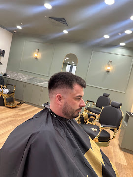 Fresh fade and beard trim finished in the barber chair at Signature Hair Styles