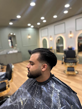Slicked back style with a beard fade finished at Signature Hair Styles