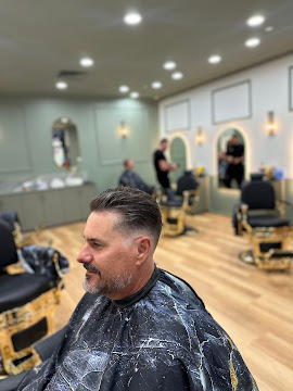 Pompadour with a sharp beard lineup finished at Signature Hair Styles